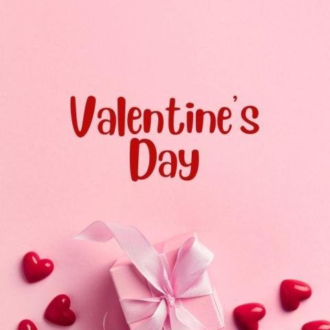 Valentine’s Day Gift Box with Red Hearts on Soft Pink Background