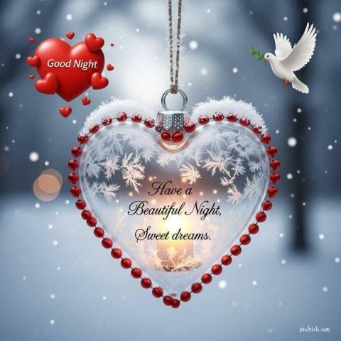 A close up of a hanging, heart shaped glass with good night quotes